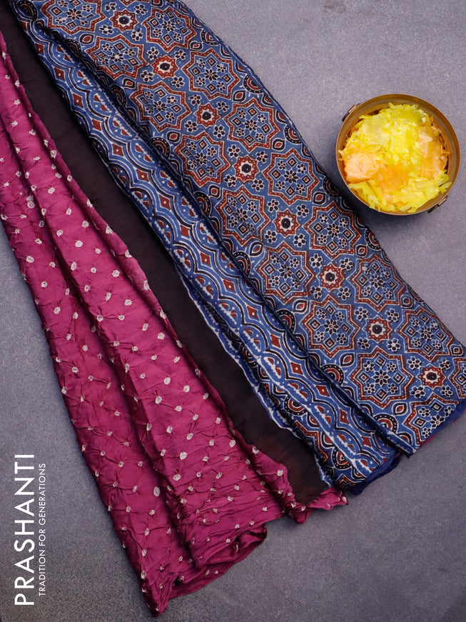 Modal silk saree purple shade and peacock blue with allover bandhani prints and ajrakh printed pallu