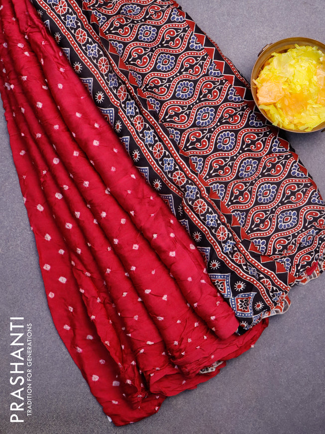 Modal silk saree pink and black with allover bandhani prints and ajrakh printed pallu