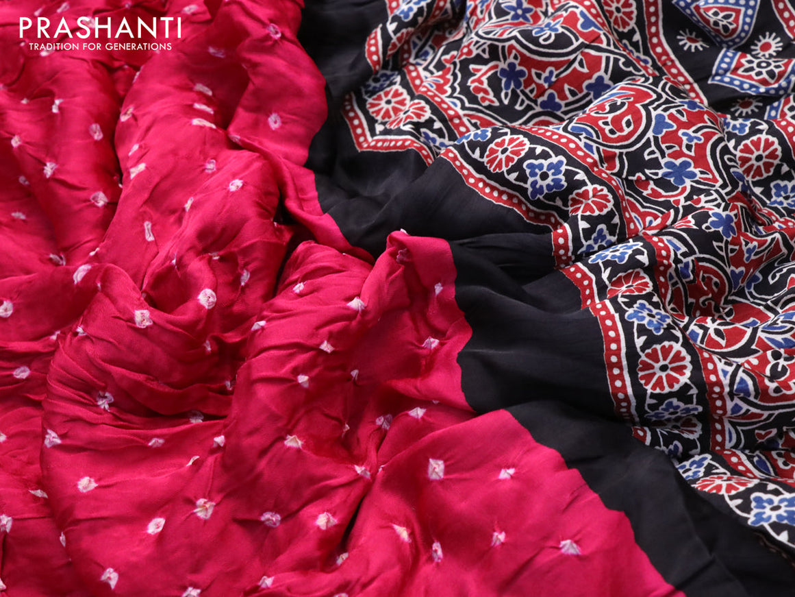 Modal silk saree pink and black with allover bandhani prints and ajrakh printed pallu