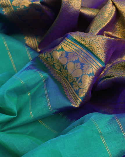 Gadwal silk cotton saree dual shade of teal green and dual shade of blue with allover zari woven buttas and paisley zari woven border
