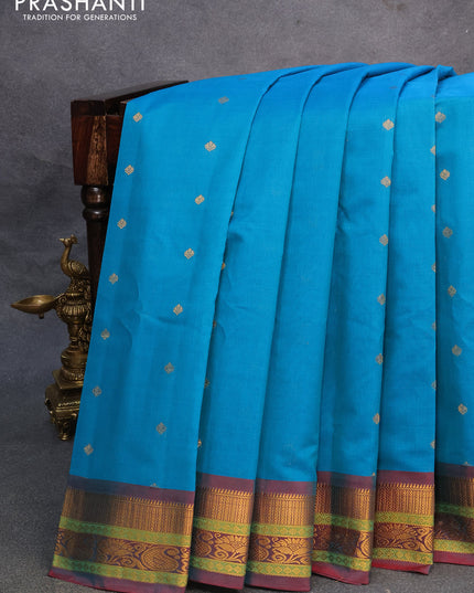 Gadwal silk cotton saree teal blue and dual shade of maroon with allover zari woven buttas and zari woven border