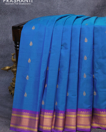 Gadwal silk cotton saree dual shade of bluish green and dual shade of purple with allover zari woven buttas and zari woven border