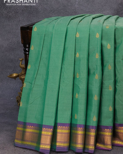 Gadwal silk cotton saree green and dual shade of purple with allover zari woven buttas and zari woven border