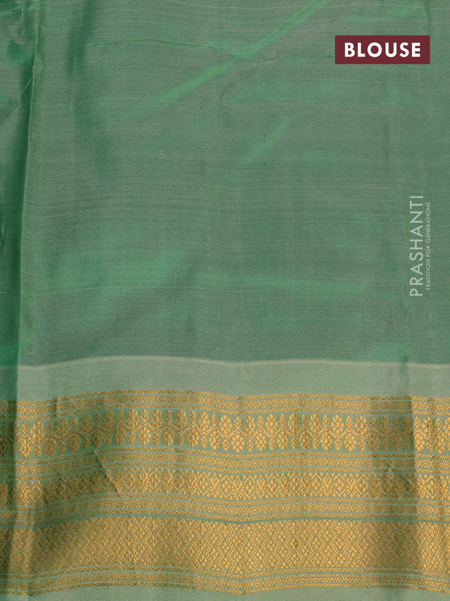 Gadwal silk cotton saree teal green shade and green shade with allover zari woven buttas and zari woven border