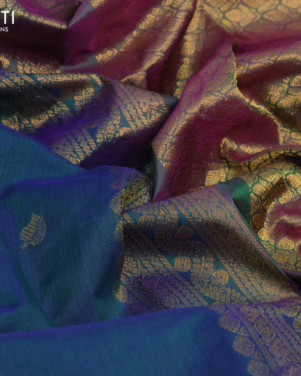 Gadwal silk cotton saree dual shade od bluish green and dual shade of purple with zari woven leaf buttas and zari woven border
