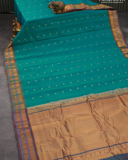 Gadwal silk cotton saree dual shade of teal bluish green and dual shade of maroon with allover zari woven buttas and zari woven border