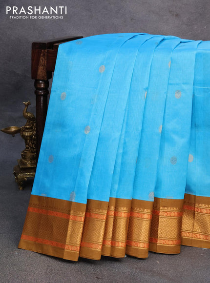 Silk cotton saree light blue and mehendi green with rudhraksha zari woven buttas and zari woven korvai border