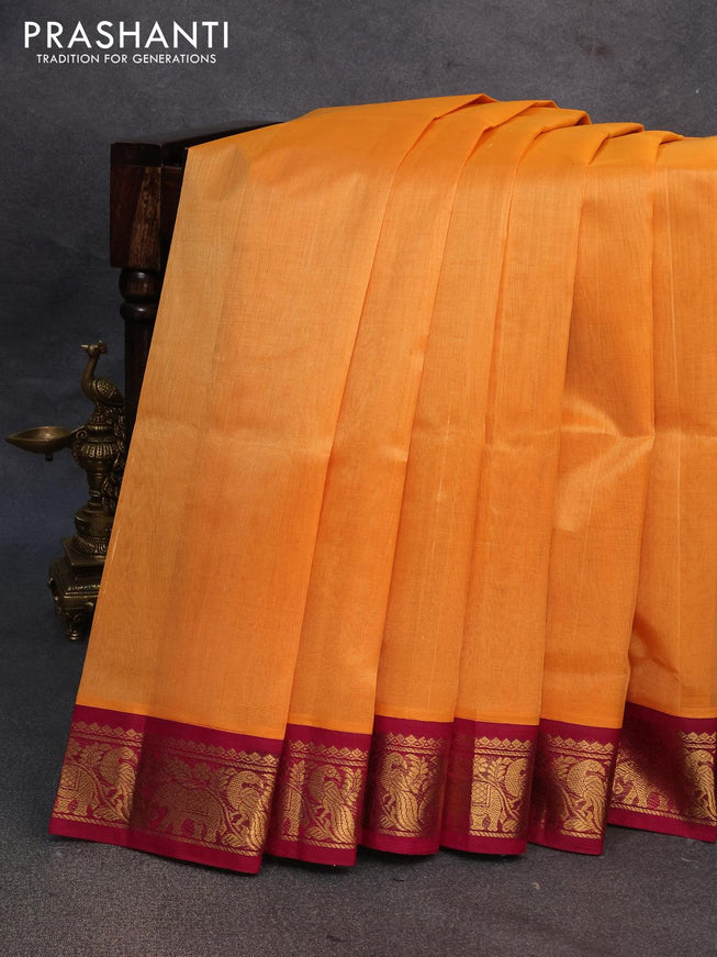 Silk cotton saree orange and magenta pink with plain body and peacock zari woven korvai border