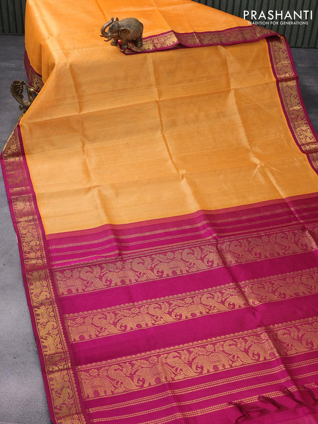 Silk cotton saree orange and magenta pink with plain body and peacock zari woven korvai border