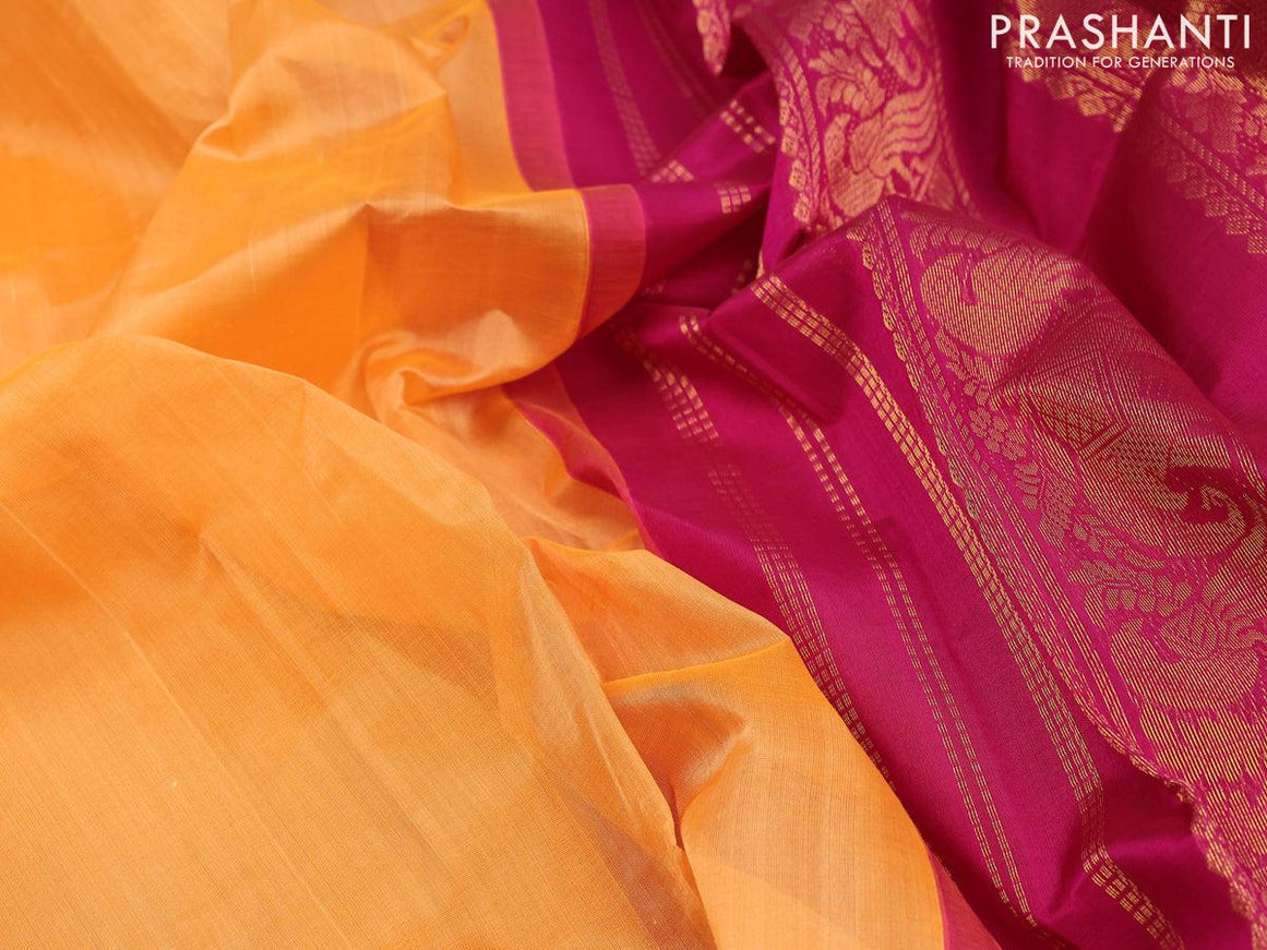 Silk cotton saree orange and magenta pink with plain body and peacock zari woven korvai border