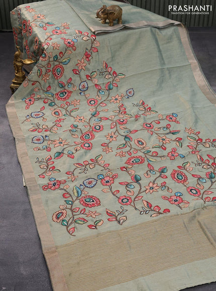 Tissue organza saree pastel green with allover kalamkari applique work and zari woven border