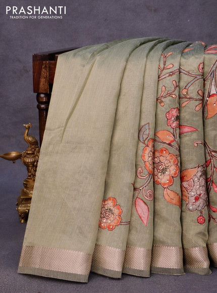 Tissue organza saree green with sequin & kalamkari applique work and zari woven border