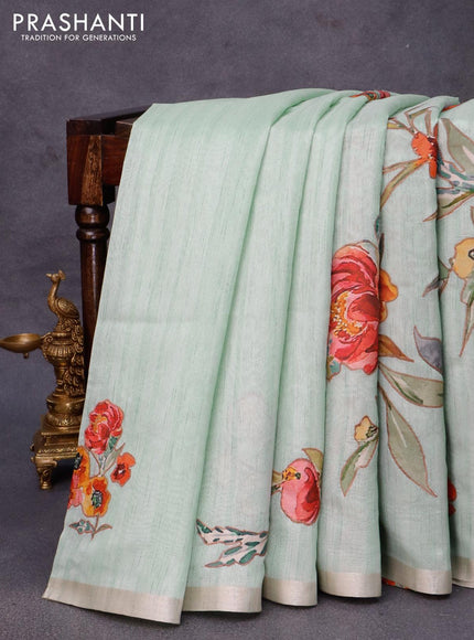 Semi tussar saree pastel green with allover floral design applique work and zari woven border