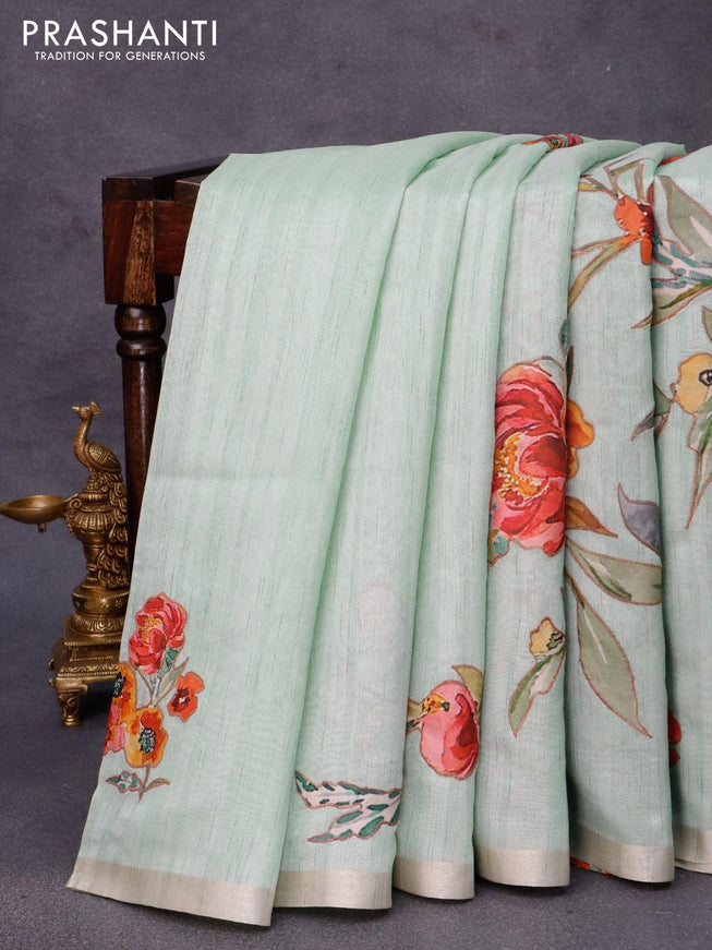 Semi tussar saree pastel green with allover floral design applique work and zari woven border