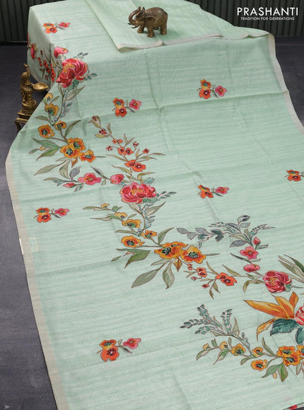 Semi tussar saree pastel green with allover floral design applique work and zari woven border