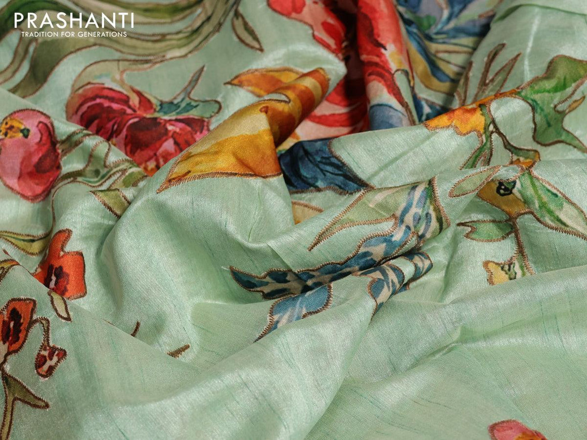 Semi tussar saree pastel green with allover floral design applique work and zari woven border