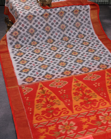 Ikat silk cotton saree off white and orange with allover ikat weaves and zari woven border