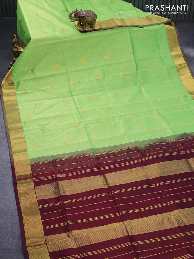 Silk cotton saree light green and deep maroon with paisley zari woven buttas and zari woven border