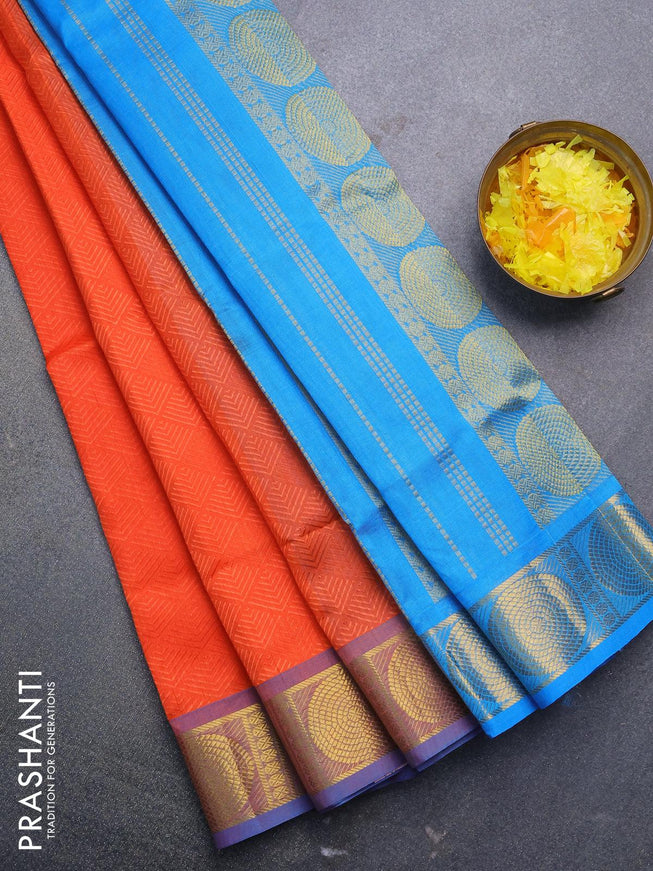 Silk cotton saree orange and light blue with allover self emboss jacquard and zari woven border