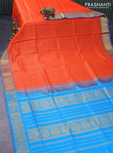 Silk cotton saree orange and light blue with allover self emboss jacquard and zari woven border