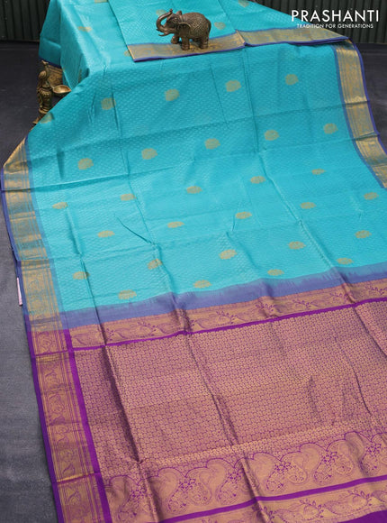 Silk cotton saree teal blue and purple with allover self emboss jacquard & zari buttas and zari woven border