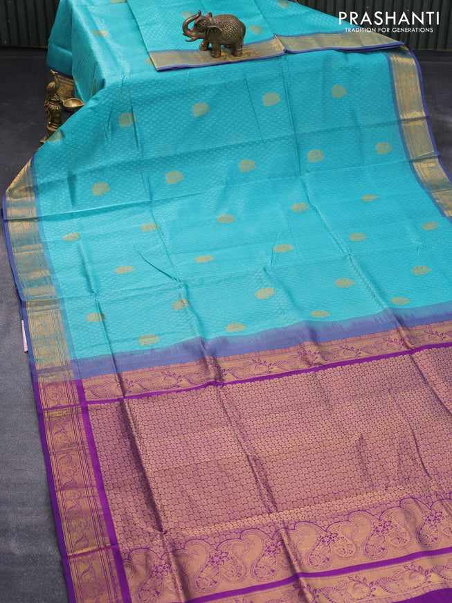 Silk cotton saree teal blue and purple with allover self emboss jacquard & zari buttas and zari woven border