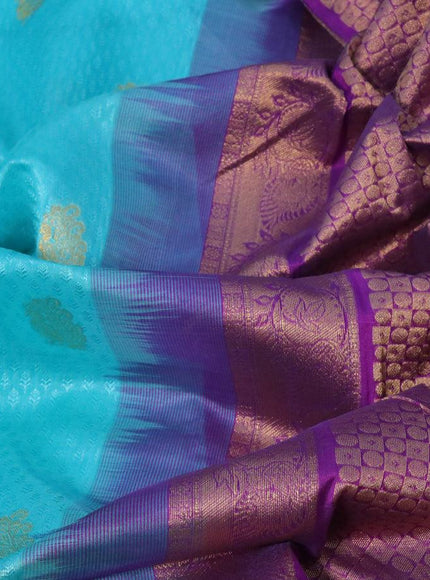 Silk cotton saree teal blue and purple with allover self emboss jacquard & zari buttas and zari woven border