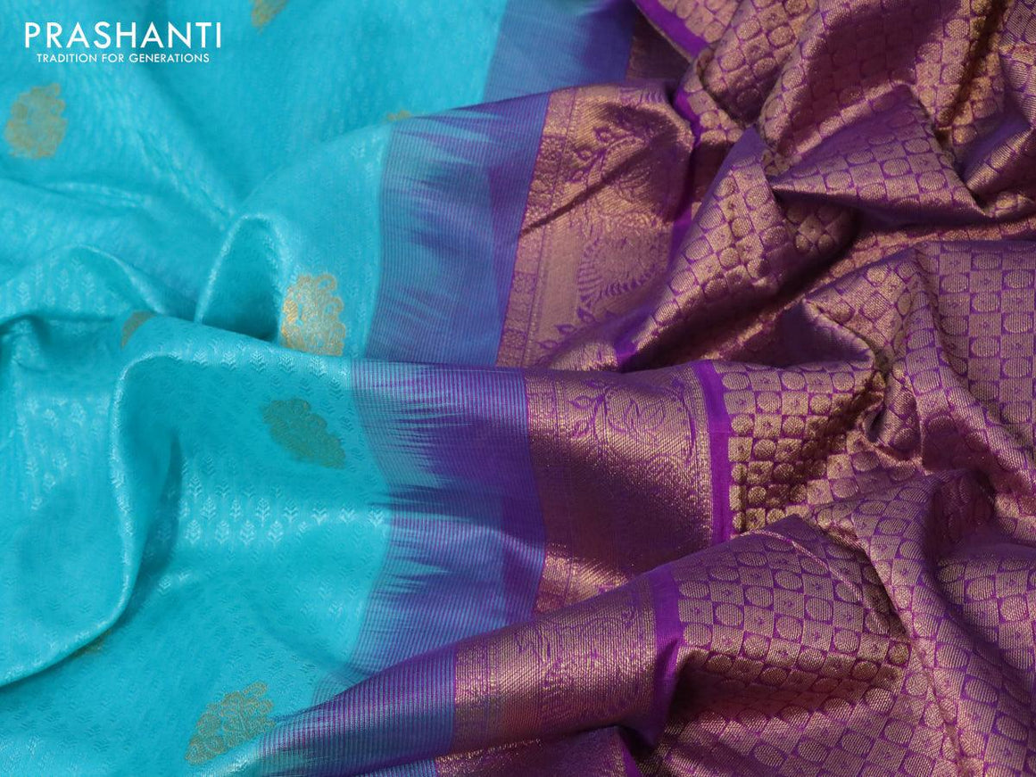 Silk cotton saree teal blue and purple with allover self emboss jacquard & zari buttas and zari woven border