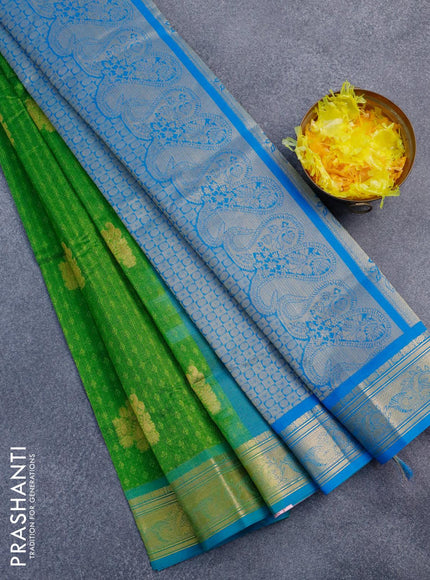 Silk cotton saree green and cs blue with allover self emboss jacquard & zari buttas and zari woven border