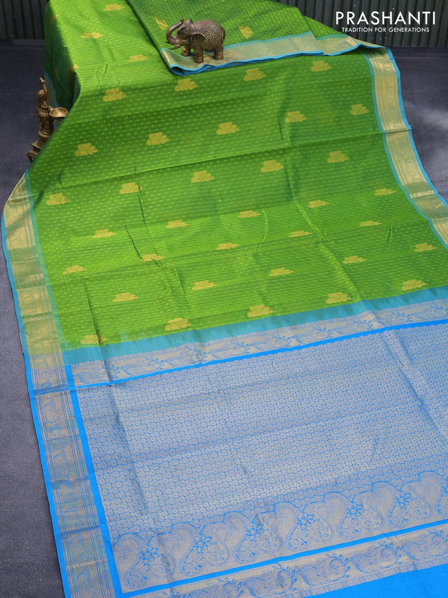 Silk cotton saree green and cs blue with allover self emboss jacquard & zari buttas and zari woven border