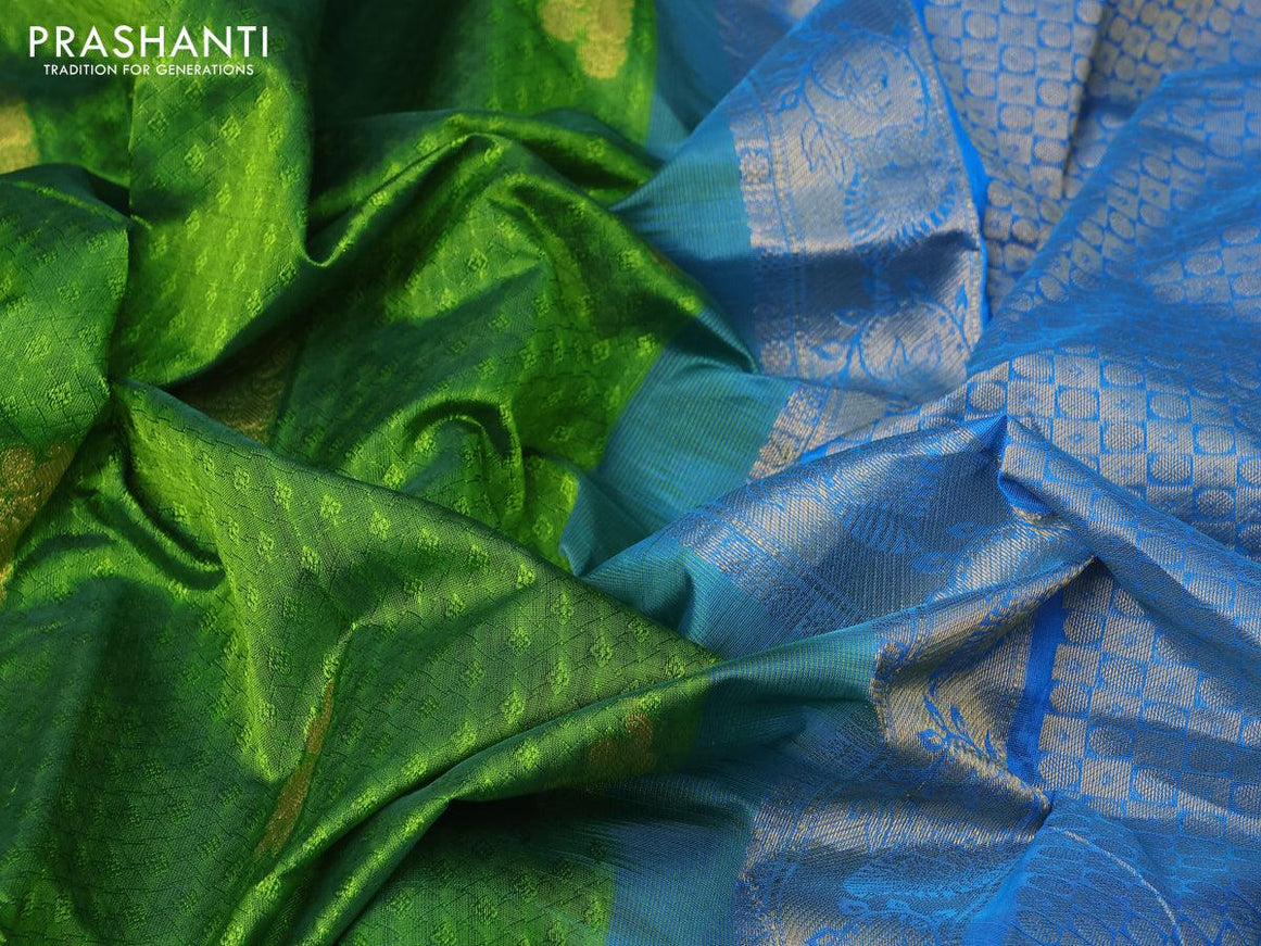 Silk cotton saree green and cs blue with allover self emboss jacquard & zari buttas and zari woven border