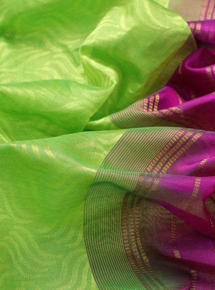 Silk cotton saree fluorescent green and magenta pink with allover self emboss jacquard and zari woven border