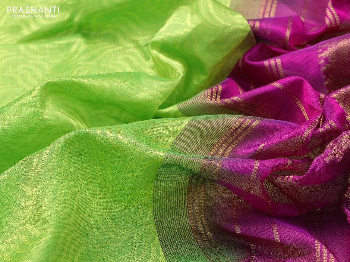 Silk cotton saree fluorescent green and magenta pink with allover self emboss jacquard and zari woven border