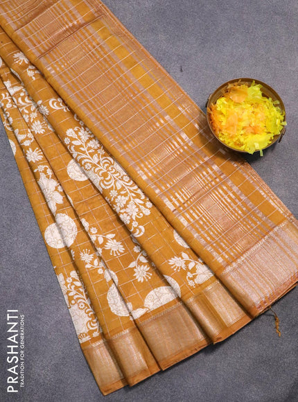 Semi gadwal saree dark mustard with allover zari checks & floral prints and zari woven border