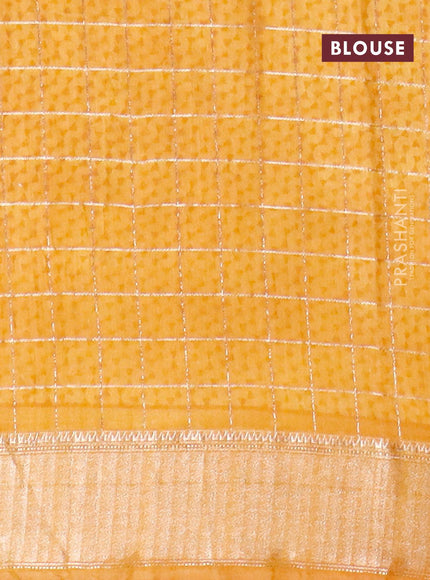 Semi gadwal saree dark mustard with allover zari checks & floral prints and zari woven border