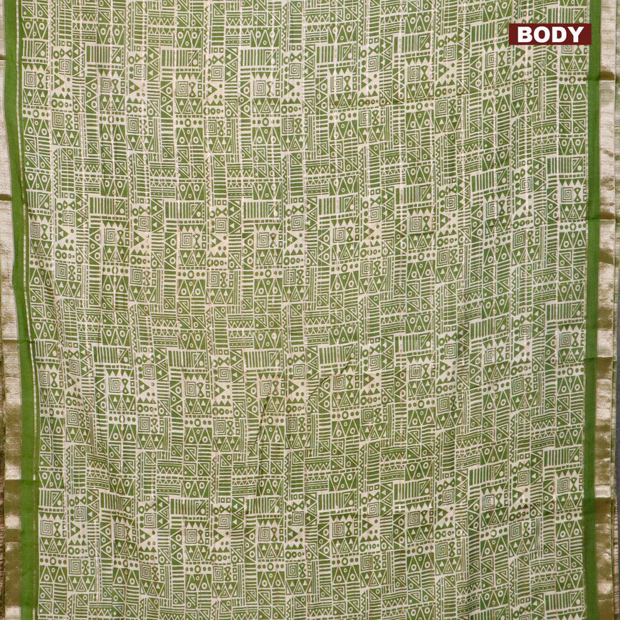 Semi gadwal saree cream and green with allover zari checks & geometric prints and zari woven border