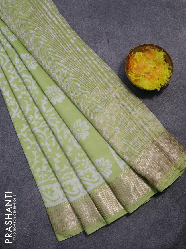 Semi gadwal saree pista green with allover batik prints and zari woven border