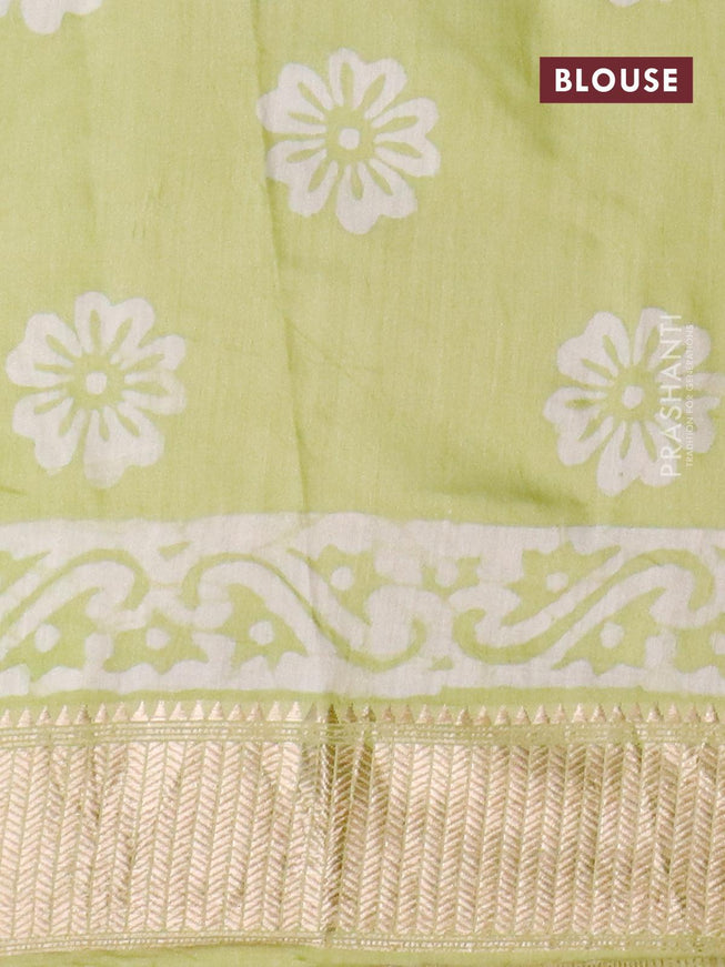 Semi gadwal saree pista green with allover batik prints and zari woven border