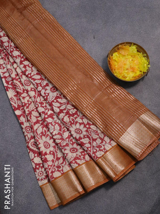 Semi gadwal saree maroon shade and dark mustard with allover floral prints and zari woven border