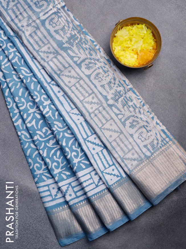 Semi gadwal saree pastel blue with allover batik prints and zari woven border