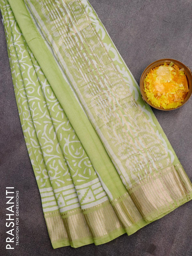 Semi gadwal saree pista green with allover batik prints and zari woven border