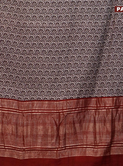 Semi gadwal saree black and maroon with allover paisley prints and zari woven border