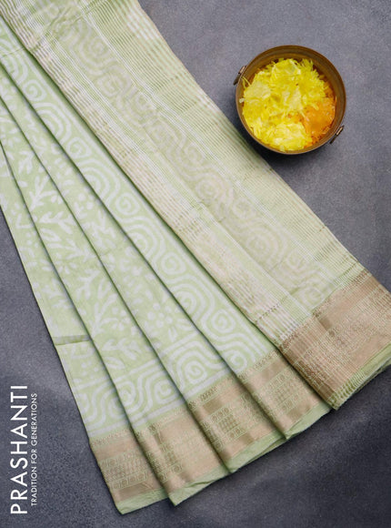 Semi gadwal saree pista green with allover prints and zari woven border