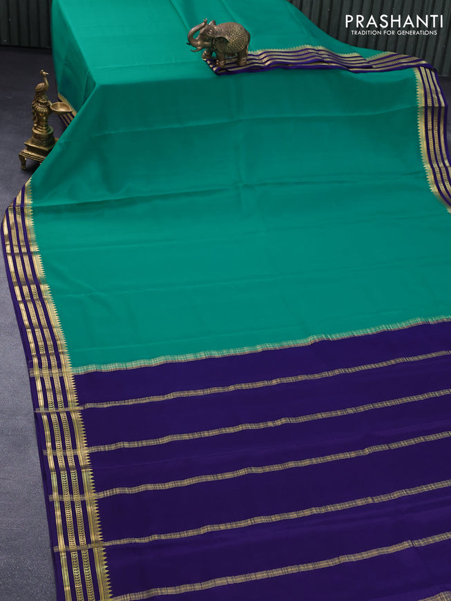 Mysore silk saree teal green and blue with plain body and zari woven border plain body