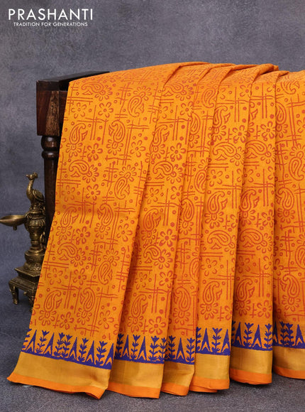 Silk cotton block printed saree mustard yellow with allover prints and zari woven border