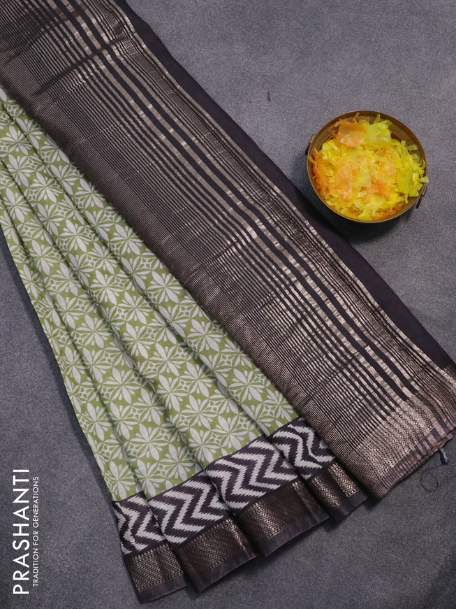 Semi gadwal saree green and elephant grey with allover prints and zari woven border
