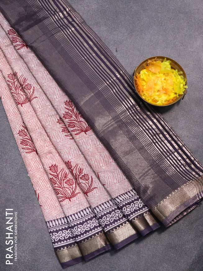 Semi gadwal saree off white pastel shade and navy blue with allover prints and zari woven border