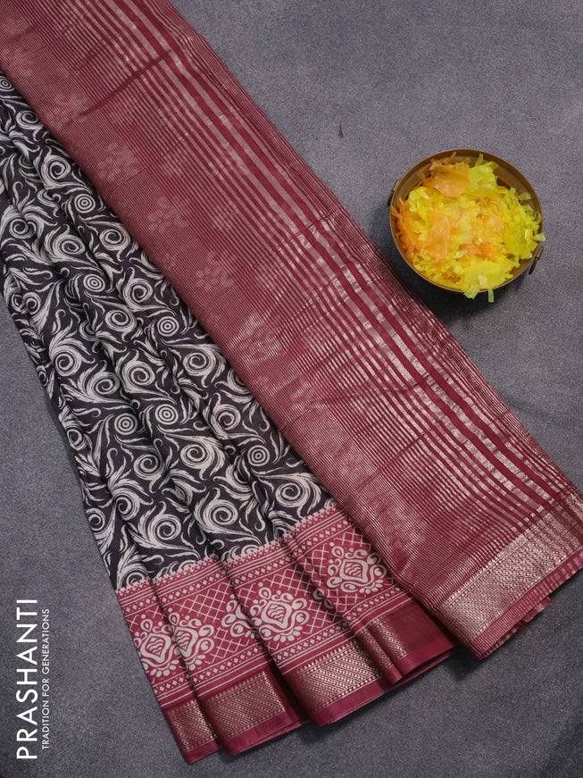Semi gadwal saree black and pastel maroon with allover prints and zari woven border