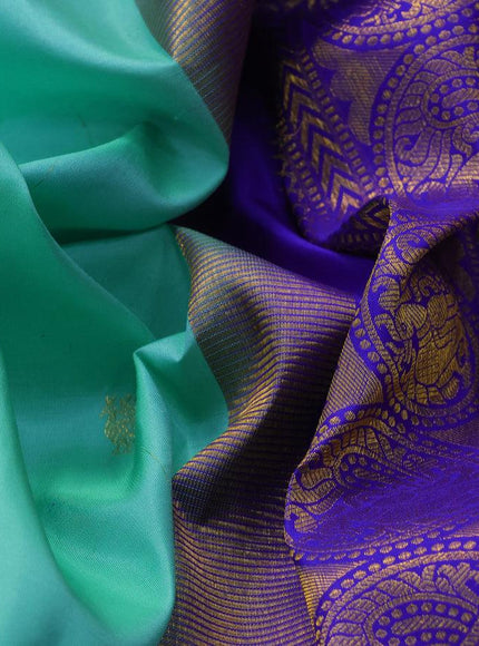 Pure kanjivaram silk saree teal green shade with annam & rudhraksha zari woven buttas and rich zari woven ganga jamuna border butta style