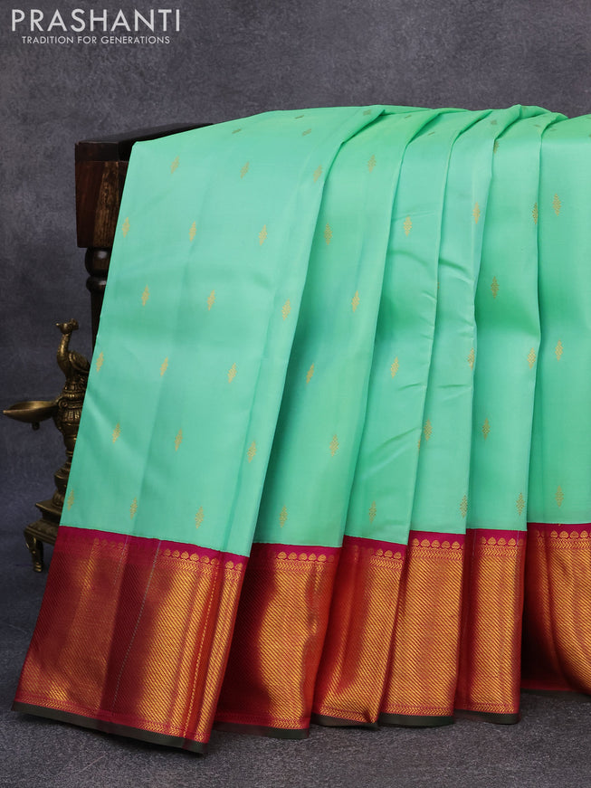 Pure kanjivaram silk saree teal green and purple with zari woven buttas and rich zari woven border butta style